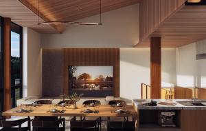 a dining room with tables and chairs and a painting on the wall at Hakuba Amber Resort by Jade Group in Hakuba