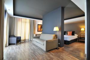 Ein Bett oder Betten in einem Zimmer der Unterkunft Hotel Jazz