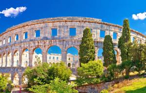a view of the colosseum with trees in front at Apartment KaLea Pula Center By Villas Guide in Pula