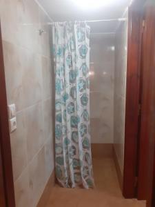 a shower in a bathroom with a shower curtain at Cerigo House in Kondoliánika +46 photos