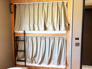 Postel nebo postele na pokoji v ubytování UBPOD- The First Capsule Hotel in Mongolia