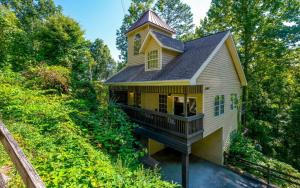 a yellow house with a tower on top of it at Coppertop View in Gatlinburg