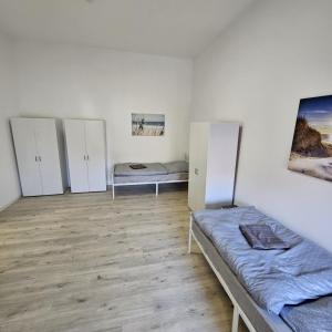 Ένα ή περισσότερα κρεβάτια σε δωμάτιο στο Cozy & warm Apartment in Hanau +40 φωτογραφίες