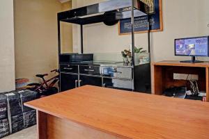a kitchen with a stove and a counter top at OYO Life 92630 Siliwangi Residence 63 in Bandung +19 photos