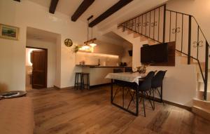 a living room with a table with chairs and a kitchen at Ferienhaus Leticia by Villas Guide in Kraljevica
