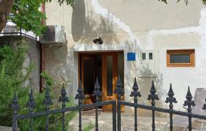 a house with a fence in front of a door at Ferienhaus Leticia by Villas Guide in Kraljevica