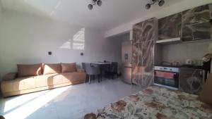 a living room with a couch and a table at Apartment Cica in Igalo