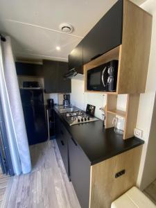 Η κουζίνα ή μικρή κουζίνα στο Mobil-Home Premium 6 couchages