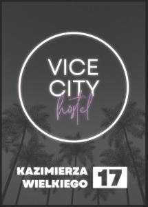 a neon sign for a vibe city hotel with palm trees at Vice City Hostel District 2 in Wrocław