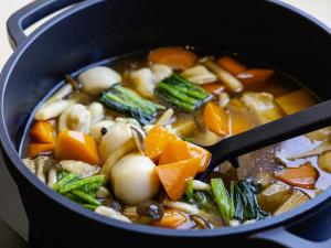 a pot of soup with a spoon in it at KOKO HOTEL Kanazawa Station in Kanazawa