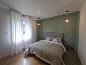 Postel nebo postele na pokoji v ubytování maison à la campagne