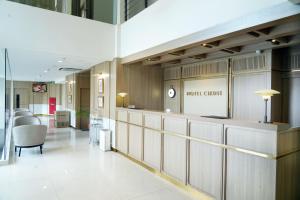 a lobby of a hotel room with a waiting area at Hotel Cikini in Jakarta