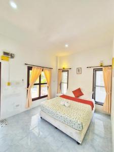 En eller flere senge i et værelse på Bungalow Banana Tikki Beach samui