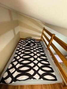a small room with a bed and a bed frame at Pokoje przy lesie in Jantar
