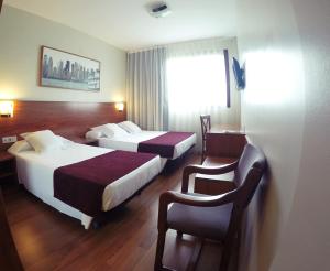 Postel nebo postele na pokoji v ubytování Hotel Reus Park + 37 fotografií