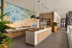 a kitchen with a counter with food on it at HIIVE by fusion Binh Duong - VSIP 1 in Thuan An