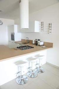 A kitchen or kitchenette at Gorgeous 2BR Gozo Apt with private balcony & Pool by 360 Estates