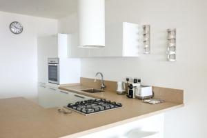 A kitchen or kitchenette at Gorgeous 2BR Gozo Apt with private balcony & Pool by 360 Estates