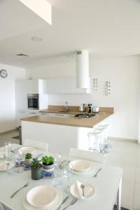 A kitchen or kitchenette at Gorgeous 2BR Gozo Apt with private balcony & Pool by 360 Estates