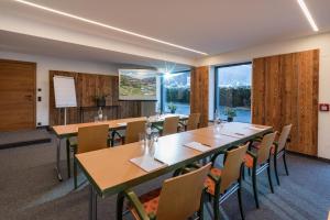 a conference room with a large table and chairs at Hotel Elisabeth, 4 Sterne Superior in Kirchberg in Tirol +176 photos
