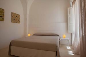 En eller flere senge i et værelse på Santa Marina Masseria del Salento