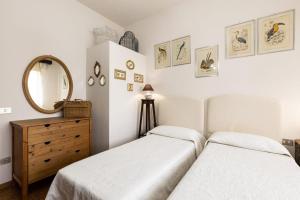 A bed or beds in a room at Villa Raffaella