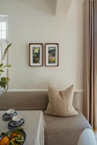a living room with a couch and a table at Cape Finest - De Waterkant House in Cape Town