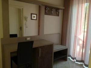 A bed or beds in a room at Hotel Fernanda
