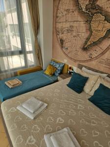 a bedroom with a large map on the wall at Apartmani Most in Mostar