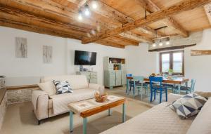 a living room with a couch and a table at Vila Azzura - Buje by Villas Guide in Buje