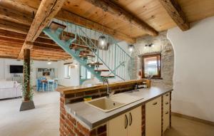 a kitchen with a sink and a staircase at Vila Azzura - Buje by Villas Guide in Buje