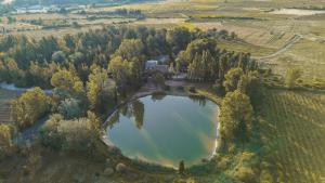 an aerial view of a lake in a field at Camping la Peiriere - Chalet & Mobile-home in Tuchan +79 photos