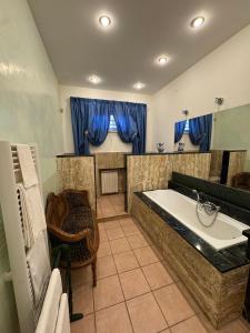 a large bathroom with a tub and a sink at Baccano Escape in Rome +21 photos