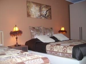 A bed or beds in a room at VILLA SINGOLA -SOLE-LUNA-Casavilladusoleil