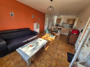 a living room with a couch and a table at La Verdière in Barjols +13 photos