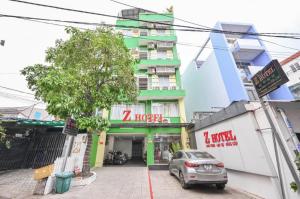 a car parked in front of a building at Z Hotel Sai Gon in Ho Chi Minh City +6 photos
