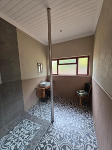 a small bathroom with a sink and a toilet at BEE-autiful Stay SC Garden Cottage in Bloemfontein