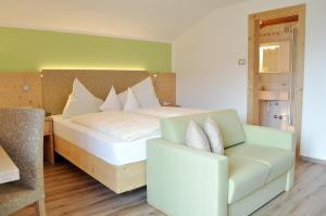 Postel nebo postele na pokoji v ubytování Hotel Karin
