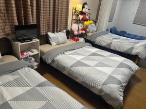 Giường trong phòng chung tại Private Inn Bambee