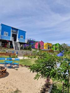 a group of colorful houses sitting on top of a beach at SORA HOME STAY Ke Ga in Láng Văn Kê