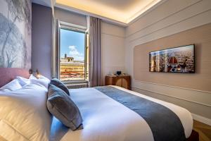 Ένα ή περισσότερα κρεβάτια σε δωμάτιο στο Dimora Collection - Le Logge - Historic Boutique Luxury Suites