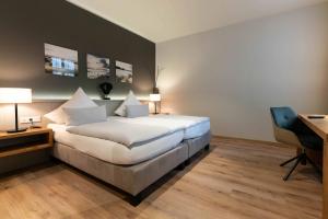 Postel nebo postele na pokoji v ubytování Hotel Friesenhof