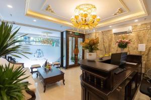 a living room with a piano and a table at Royal Hotel Kangnam in Hanoi