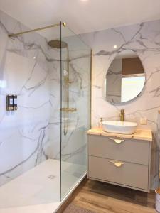 a bathroom with a shower and a sink at De Marbre et D or entre le futuroscope et le parc du Puy duFou in Boësse +14 photos