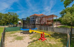 a playground in front of a house at Villa Ruza - Omis by Villas Guide in Blato na Cetini