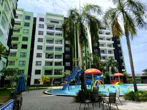 a playground in front of a apartment building at Ipoh Manhattan Free Waterpark 3BR 8Pax Family Suite MHA308 by City Home Empire in Ipoh