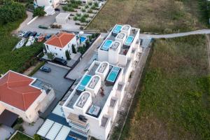 an overhead view of a large white house with red roofs at Villa Miri R2 in Privlaka