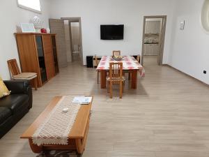 a living room with a couch and a table at HomeSweetHome in Salento in Veglie