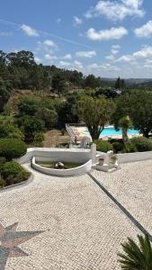 a resort with a swimming pool and a resort at Quinta da Carlota in Torres Vedras