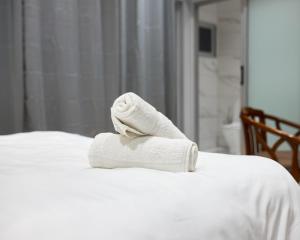 a towel sitting on top of a bed at Cycad Beach Resort- Chalets in Praia de Macaneta +2 photos